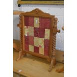 A pine framed fire screen.