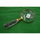 A decorative magnifying glass.