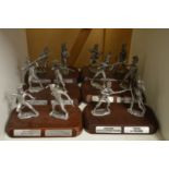 A set of six cast metal models of soldiers on wooden bases.