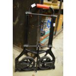 A folding luggage trolley.