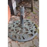 A cast metal parasol base.