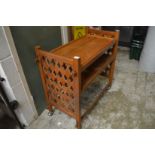 A teak drinks trolley.