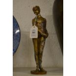 A bronze figure a standing female nude.