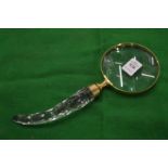 A decorative magnifying glass.