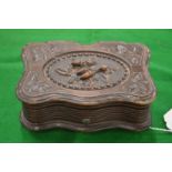 A small Continental carved wood music box.