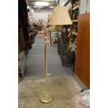 A brass floor standing lamp.