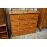 A pine four drawer chest.