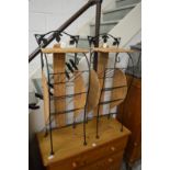 Two small wicker and wrought iron magazines racks/stands.