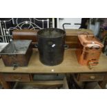 Two copper hot water vessels with taps together with twin handled metal tub.