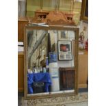 A decoratively framed 19th century mirror.
