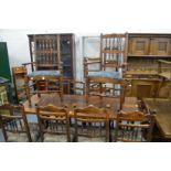 A pair of oak Lancashire spindle back armchairs and four similar single chairs.