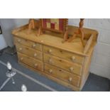 A pine six drawer chest.