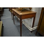 An oak two drawer side table, possibly Heals or similar.