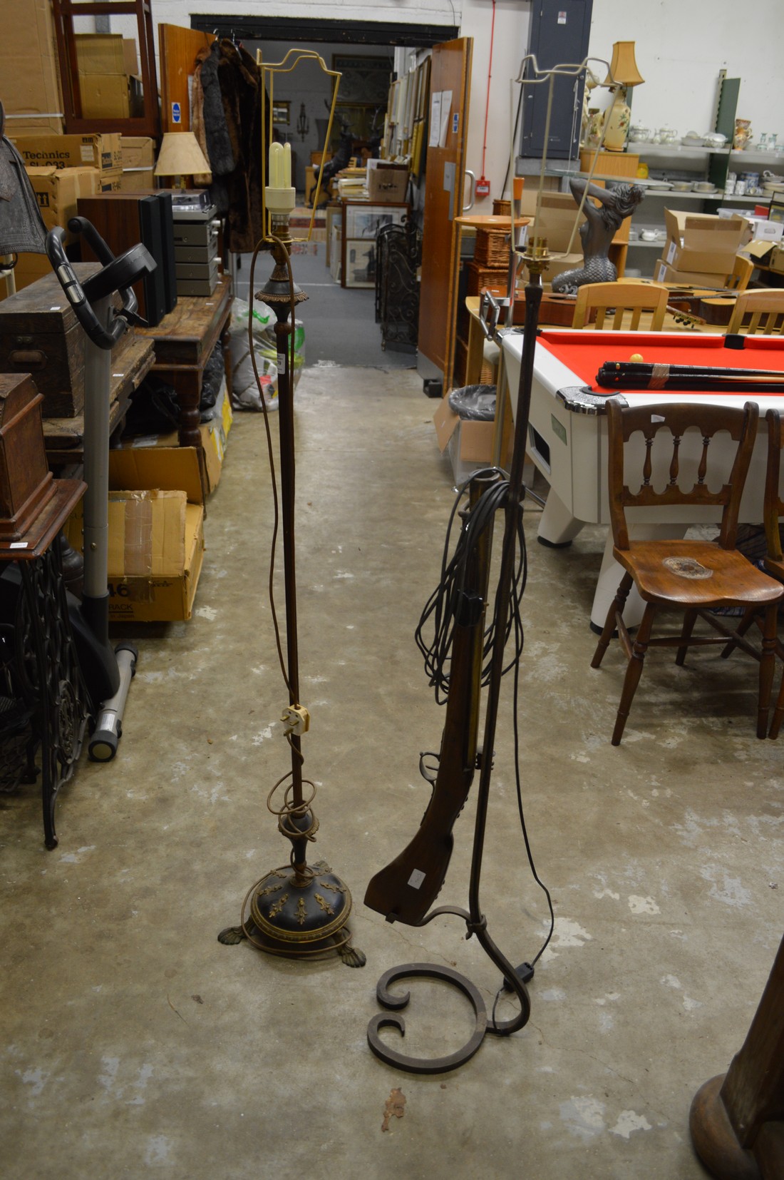 Two decorative floor standing lamps.