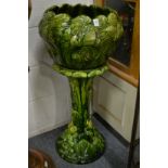 An Ault Oceana green glazed jardiniere and stand.