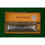A Hohner accordion, boxed.