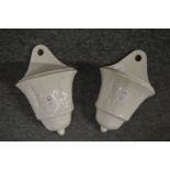 A pair of Continental white pottery wall pockets.