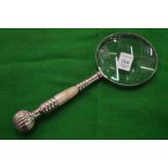 A decorative magnifying glass.