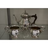 A plated three piece tea service.