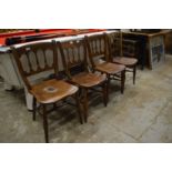 A matched set of four 19th century beech and elm spindle back chairs.