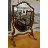A shield shaped dressing table mirror.
