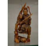 A good Chinese carved horn figure of a deity on horse back.