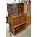 A mid-century rosewood three section wall unit.