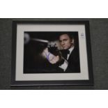 A small photographic print of Daniel Craig, bears initials.