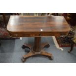 A 19th century rosewood D shaped foldover card table.