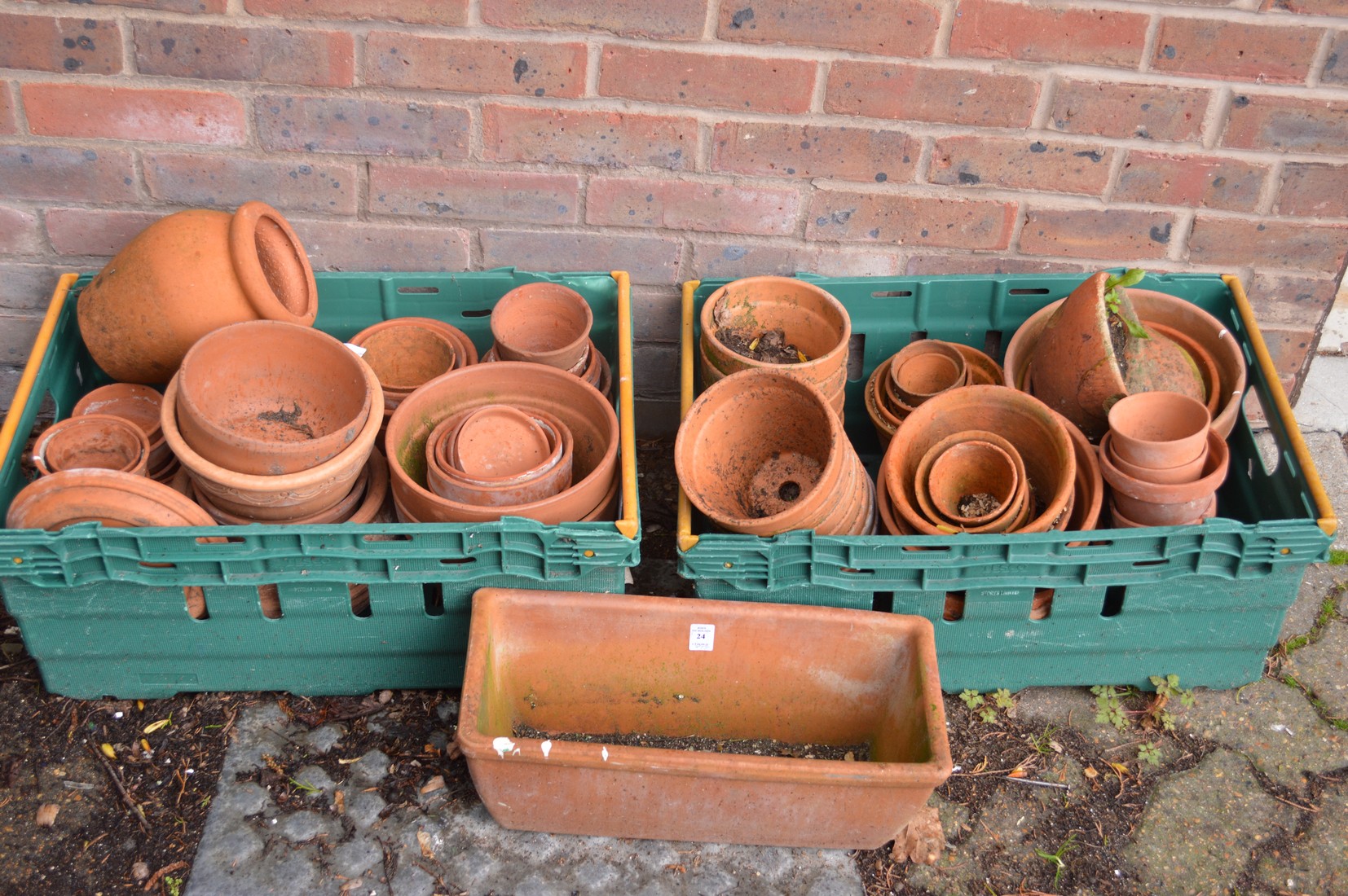 A quantity of terracotta plant pots.