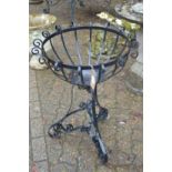 A wrought iron plant stand.