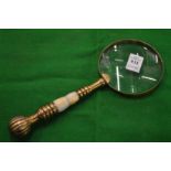 A decorative magnifying glass.