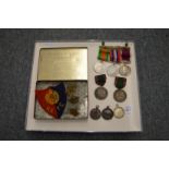 A small group of medals and awards for R Benchley to include a regular army long service medal,