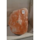 A large rock salt lamp.