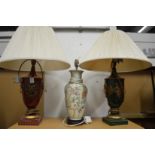 Two Toleware style urn shaped table lamps and a Chinese style lamp.