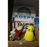 An old desk fan, desk lamp and two enamel signs.