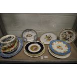 A collection of decorative plates and dishes.