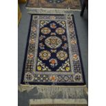 A Chinese rug 153cm x 92cm.