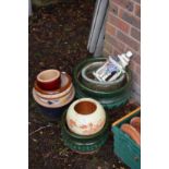 A small group of glazed plant pots.