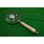 A decorative magnifying glass.