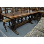 An oak refectory style dining table.