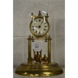 A brass anniversary style clock with glass dome.