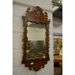 A walnut fretwork framed mirror with gilded decoration (losses).