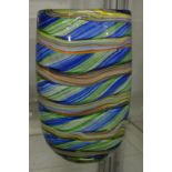 A large colourful art glass vase.