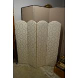 A classically upholstered four panel folding dressing screen.