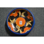 A Clarice Cliff Bizarre circular bowl (broken and restored).