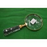 A decorative magnifying glass.