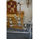 A stylish chrome plated nine branch chandelier.
