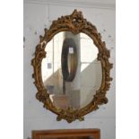 A gilt plaster framed mirror.