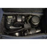 A Canon EOSD60 camera with accessories in a camera bag.
